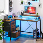 Scrivania da Gaming a L con Prese Elettriche e Luci LED