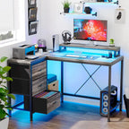 Scrivania da Gaming a L con Prese Elettriche e Luci LED